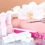 Pedicure set on table on beige background