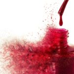 Exploding bottle of red nail varnish