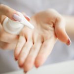 Scin Care. Scientist hands testing texture of beauty products